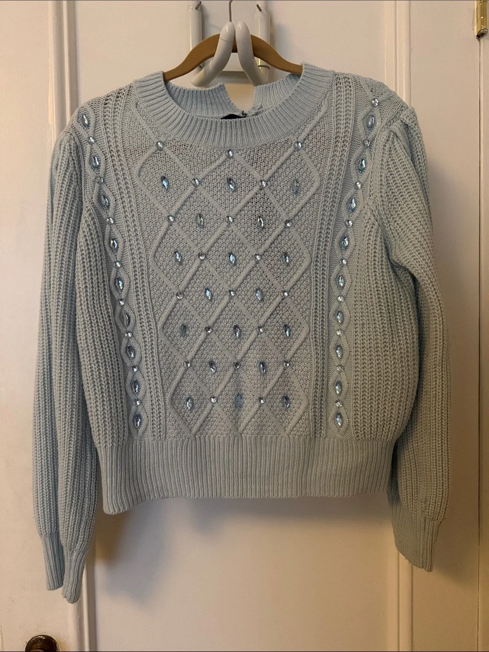 Elegant Light Blue Knit Sweater with Embellishments